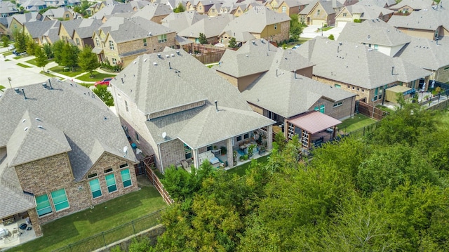birds eye view of property with a residential view