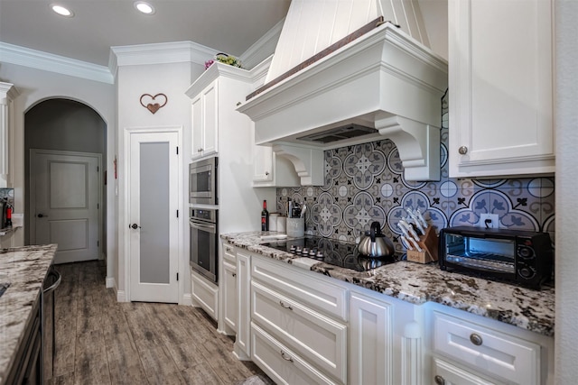 400 Christian Way, Azle, TX 76020 - kitchen featuring appliances with stainless steel finishes, premium range hood, tasteful backsplash, and white cabinets