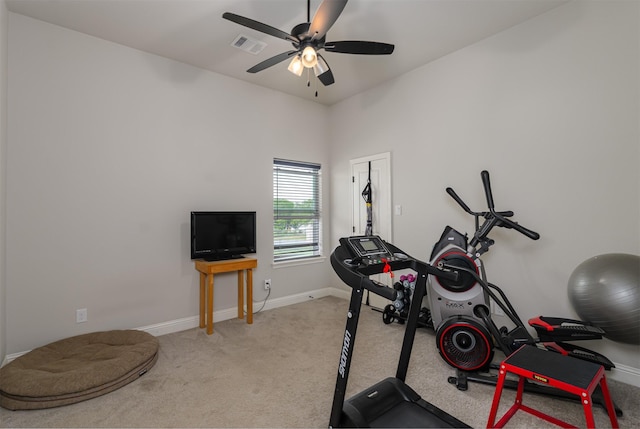 workout room featuring visible vents, a ceiling fan, baseboards, and carpet floors