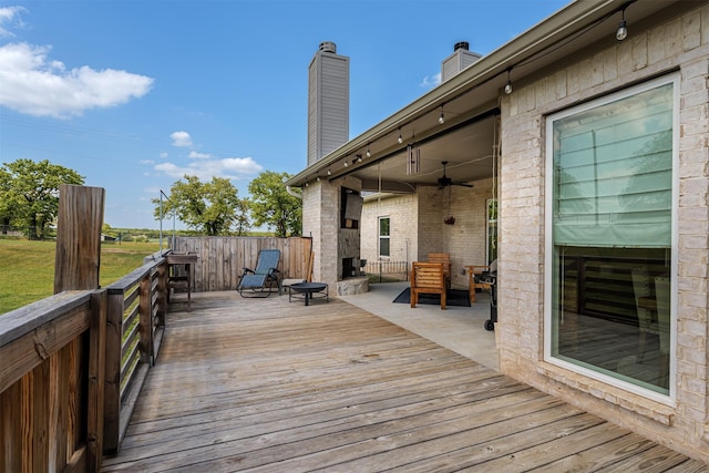 wooden deck with ceiling fan