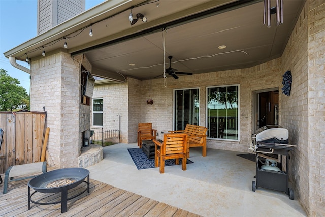 view of patio / terrace featuring fence, ceiling fan, and area for grilling