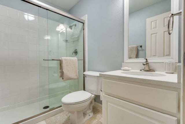 full bath with vanity, tile patterned floors, a stall shower, and toilet