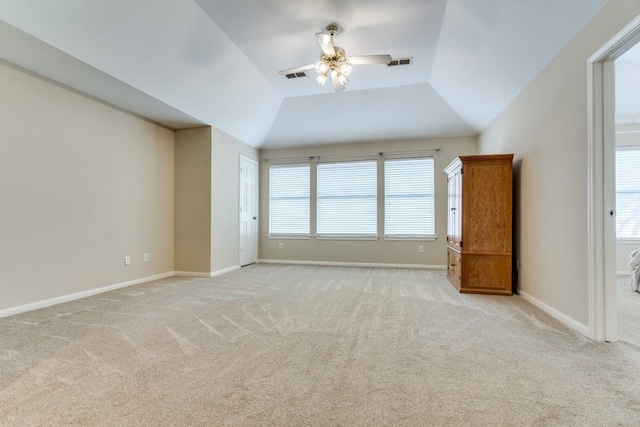 interior space with light carpet, a ceiling fan, and visible vents