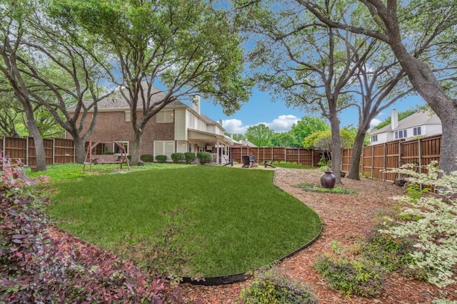 view of yard featuring a fenced backyard