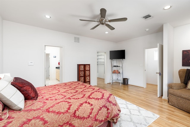 4030 Travis St Unit A, Dallas, TX 75204 - bedroom with light wood finished floors, recessed lighting, a ceiling fan, and connected bathroom