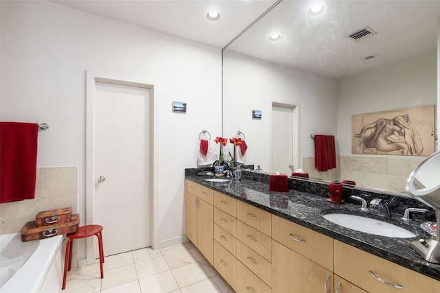 4030 Travis St Unit A, Dallas, TX 75204 - full bathroom featuring double vanity, a tub, tile patterned flooring, and recessed lighting