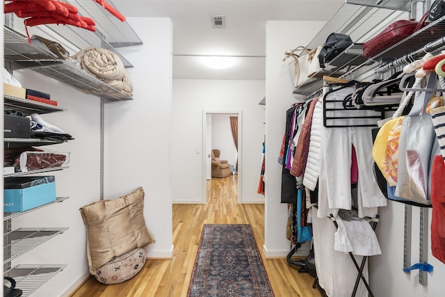 spacious closet with wood finished floors and visible vents
