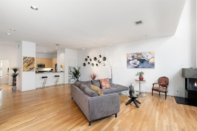 4030 Travis St Unit A, Dallas, TX 75204 - living area with light wood-style floors, recessed lighting, and baseboards
