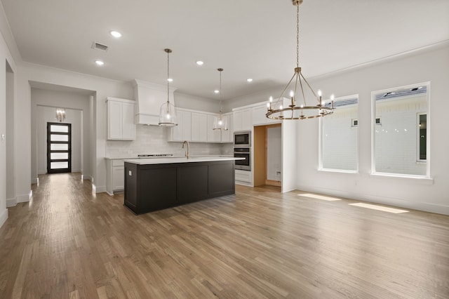 201 Kingfisher Ct, Aledo, TX 76008 - kitchen featuring oven, built in microwave, a chandelier, white cabinetry, and recessed lighting