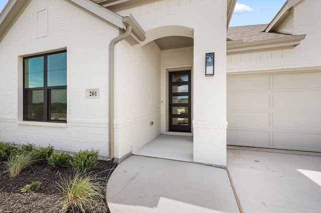 201 Kingfisher Ct, Aledo, TX 76008 - property entrance with brick siding, an attached garage, and roof with shingles