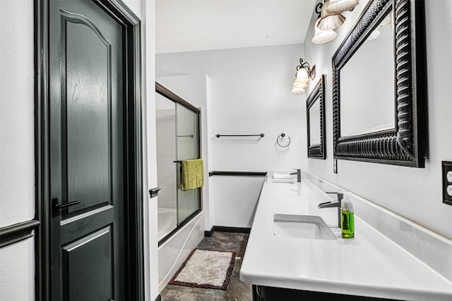 bathroom with a sink, baseboards, enclosed tub / shower combo, and double vanity