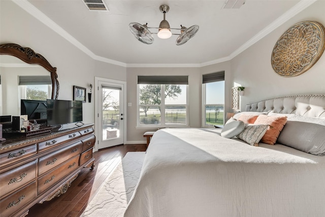 bedroom featuring crown molding, access to outside, dark wood-style flooring, and visible vents