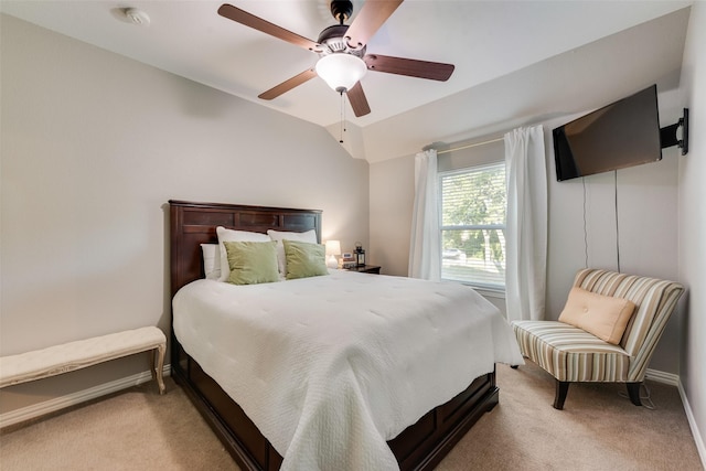 carpeted bedroom featuring ceiling fan and baseboards