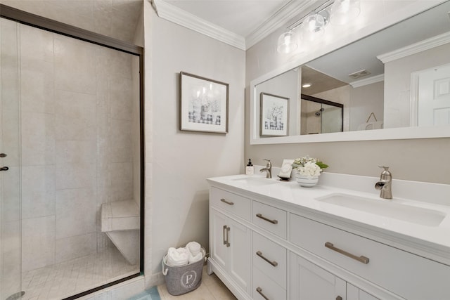 full bath featuring a sink, crown molding, a stall shower, and visible vents