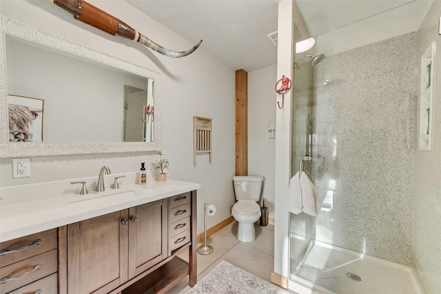 full bathroom featuring vanity, toilet, tile patterned floors, and a stall shower