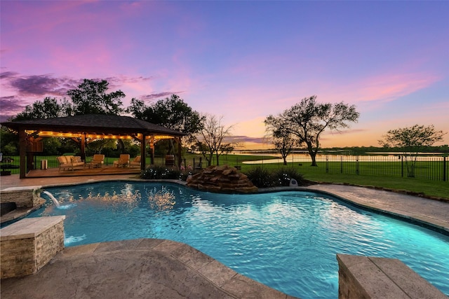 view of swimming pool with a gazebo, fence, and a fenced in pool