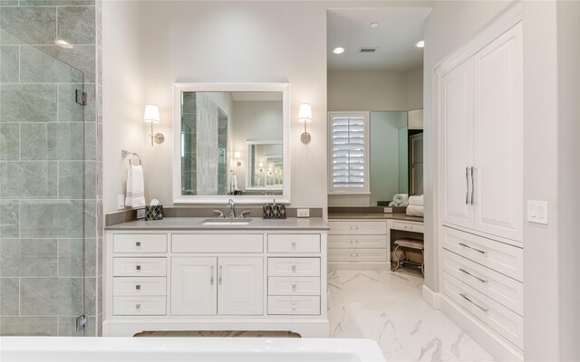 full bath with vanity, a tile shower, marble finish floor, and visible vents