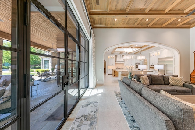 living room featuring recessed lighting, wood ceiling, arched walkways, and beam ceiling