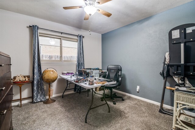 home office featuring carpet floors, a ceiling fan, and baseboards