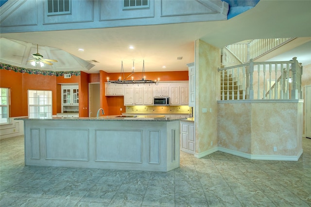 2160 W Fm 550, Mclendon Chisholm, TX 75032 - kitchen with stainless steel microwave, a sink, a chandelier, a spacious island, and light stone countertops