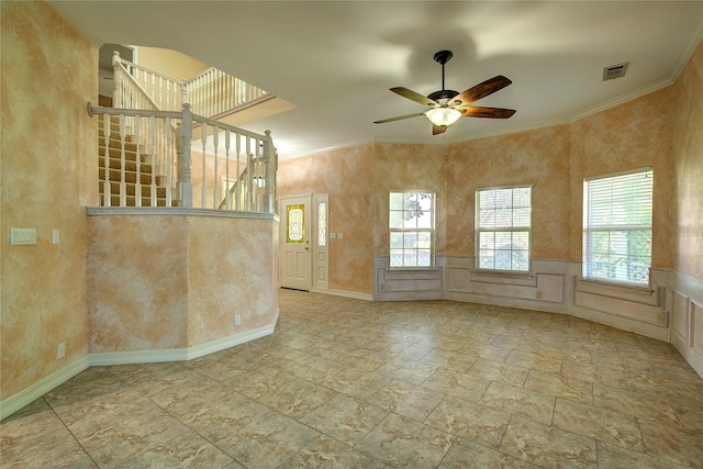2160 W Fm 550, Mclendon Chisholm, TX 75032 - unfurnished living room featuring a ceiling fan, crown molding, stone finish flooring, stairway, and baseboards