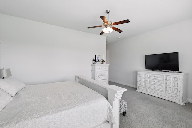 carpeted bedroom with baseboards and ceiling fan
