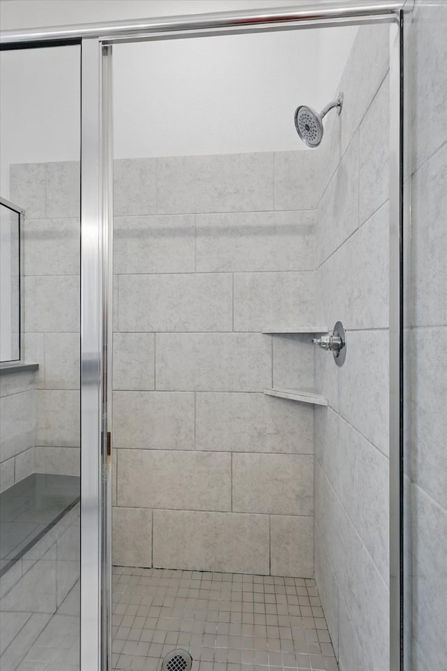 bathroom featuring a shower stall