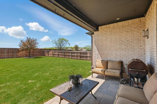 view of yard with an outdoor living space, a fenced backyard, and a patio area