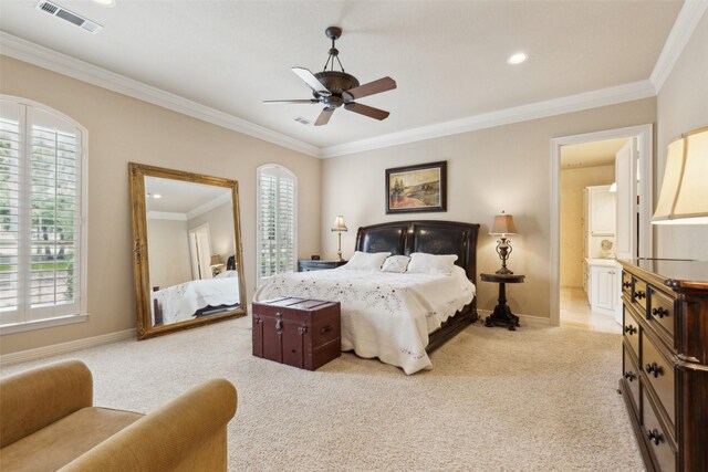 bedroom featuring carpet flooring, visible vents, and multiple windows