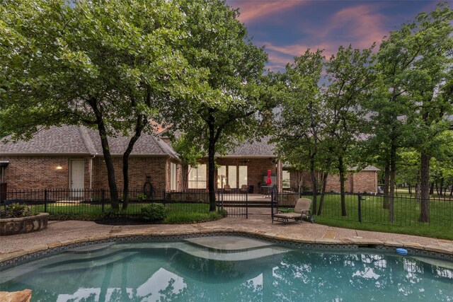 view of pool featuring a fenced in pool, a patio area, and fence