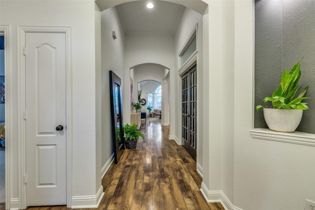 5000 Stonecrest Dr, Mckinney, TX 75071 - corridor with arched walkways, dark wood-style floors, and baseboards