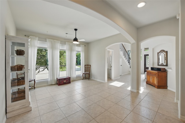 400 Sterling Rdg, Lantana, TX 76226 - interior space featuring ceiling fan, arched walkways, light tile patterned floors, and visible vents