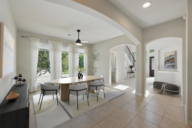 400 Sterling Rdg, Lantana, TX 76226 - dining room featuring a ceiling fan, baseboards, light tile patterned flooring, visible vents, and arched walkways