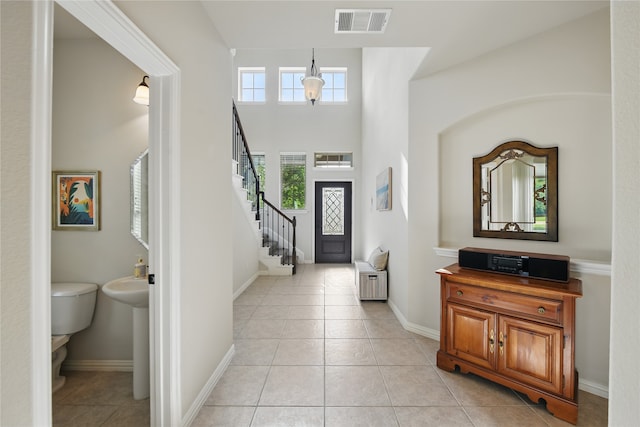 400 Sterling Rdg, Lantana, TX 76226 - foyer featuring light tile patterned floors, visible vents, baseboards, and stairway