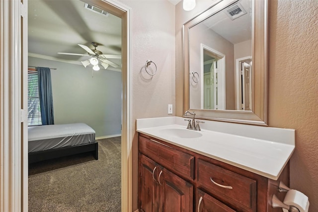 5801 Red Drum Dr, Fort Worth, TX 76179 - bathroom with vanity, ceiling fan, ornamental molding, baseboards, and a textured wall