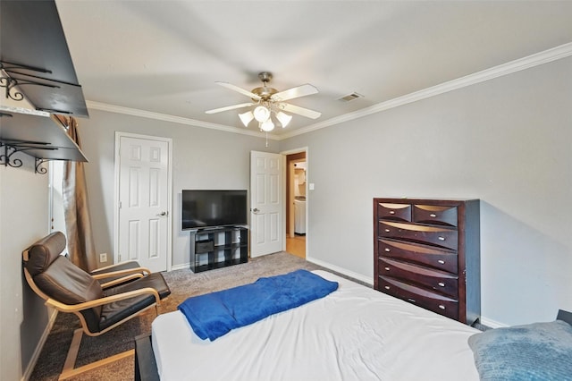 bedroom featuring baseboards, ornamental molding, carpet floors, and visible vents