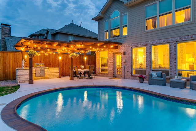view of pool featuring a fenced in pool, outdoor lounge area, a patio area, and fence