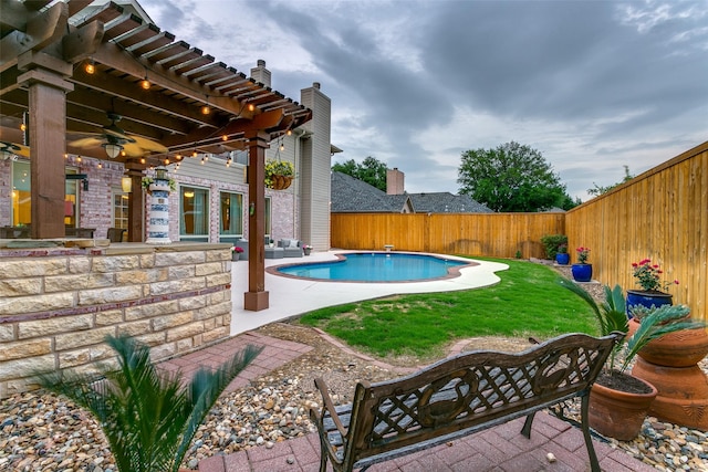 view of swimming pool with a fenced backyard, an outdoor living space, a fenced in pool, a patio area, and a lawn