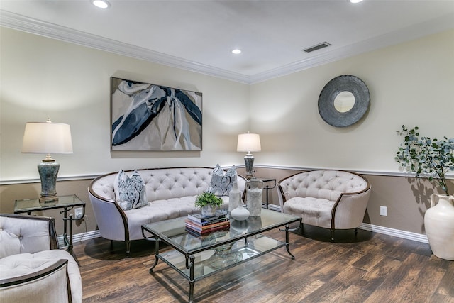 living area with baseboards, ornamental molding, wood finished floors, and visible vents
