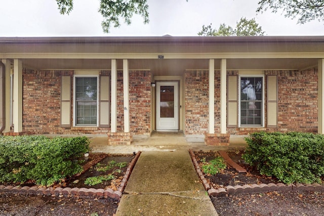 1907 Rambling Ridge Ln, Carrollton, TX 75007 - property entrance featuring covered porch and brick siding
