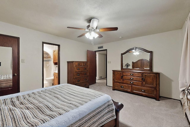 1907 Rambling Ridge Ln, Carrollton, TX 75007 - bedroom featuring ceiling fan, visible vents, light carpet, and ensuite bathroom
