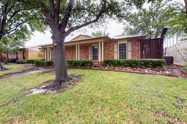 1907 Rambling Ridge Ln, Carrollton, TX 75007 - single story home featuring brick siding, a front yard, and cooling unit