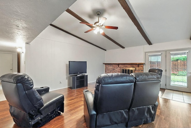 1907 Rambling Ridge Ln, Carrollton, TX 75007 - living area with lofted ceiling with beams, a ceiling fan, and wood finished floors