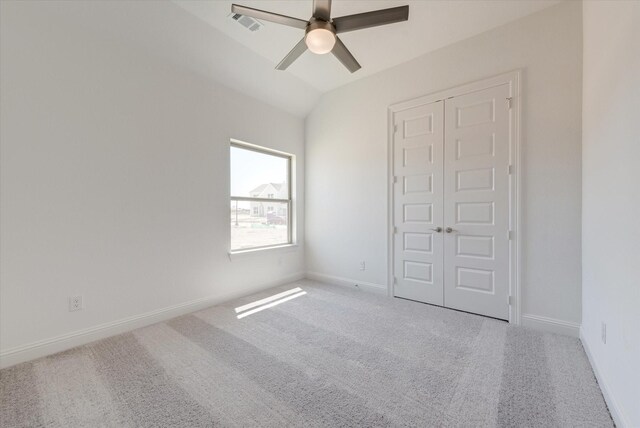 unfurnished bedroom featuring baseboards, carpet flooring, and visible vents