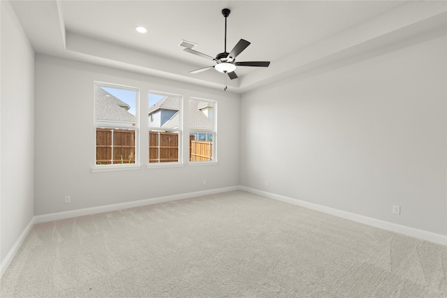2206 Stratford Rd, Rockwall, TX 75087 - empty room with light carpet, a tray ceiling, a ceiling fan, baseboards, and recessed lighting
