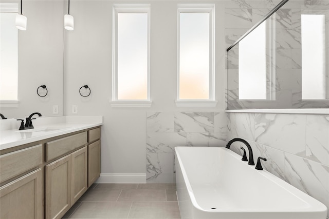 2206 Stratford Rd, Rockwall, TX 75087 - full bath with healthy amount of natural light, a freestanding bath, vanity, and baseboards