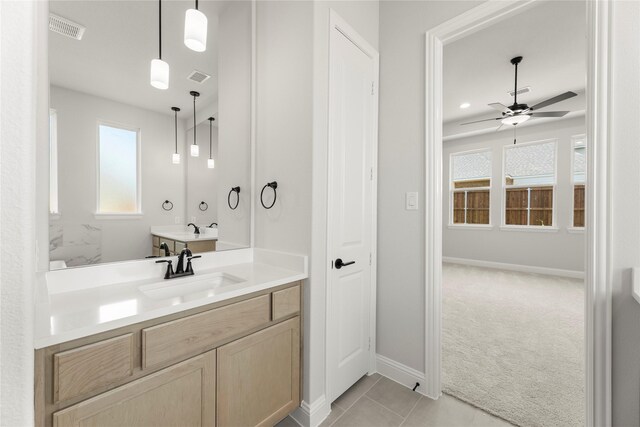 2206 Stratford Rd, Rockwall, TX 75087 - bathroom with a ceiling fan, baseboards, vanity, and tile patterned flooring
