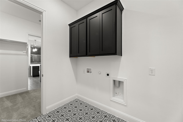 laundry room with washer hookup, hookup for an electric dryer, hookup for a gas dryer, cabinet space, and baseboards