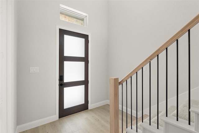 2206 Stratford Rd, Rockwall, TX 75087 - foyer entrance featuring wood finished floors, stairway, and baseboards
