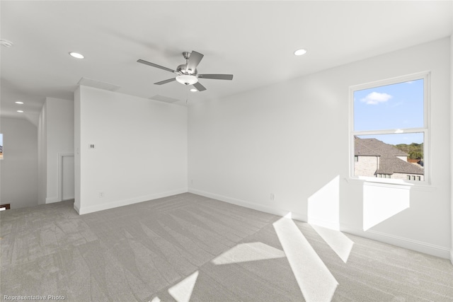 carpeted spare room featuring baseboards, a ceiling fan, and recessed lighting